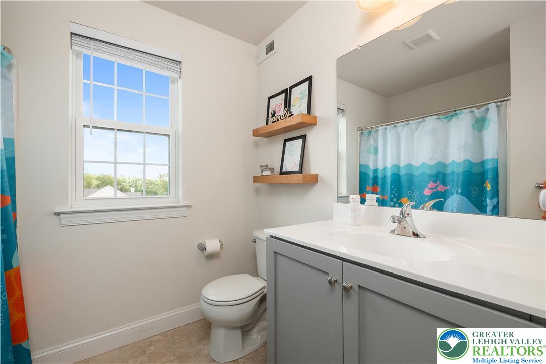 840 Texas Road Easton, PA 18042 - Photo 42 of 49 a bathroom with a sink a toilet and a window