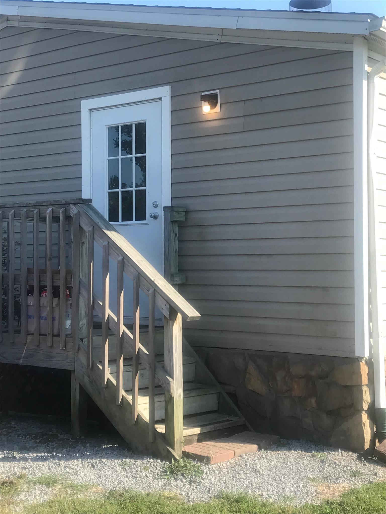 7596 Franklin Road Mount Juliet, TN 37122 - Photo 11 of 16 a view of wooden house with large windows