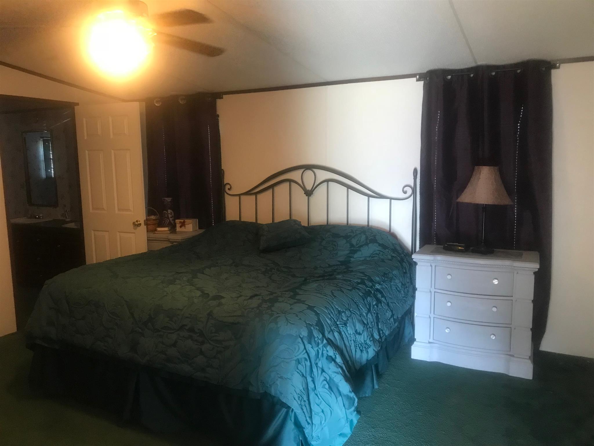 7596 Franklin Road Mount Juliet, TN 37122 - Photo 7 of 16 a bedroom with a bed and a dresser