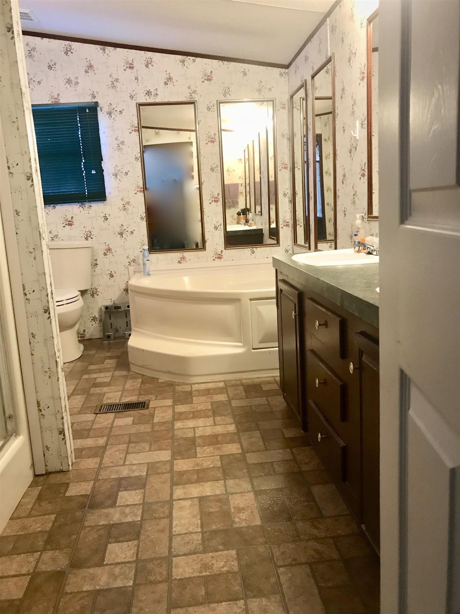7596 Franklin Road Mount Juliet, TN 37122 - Photo 8 of 16 a bathroom with a sink toilet and mirror