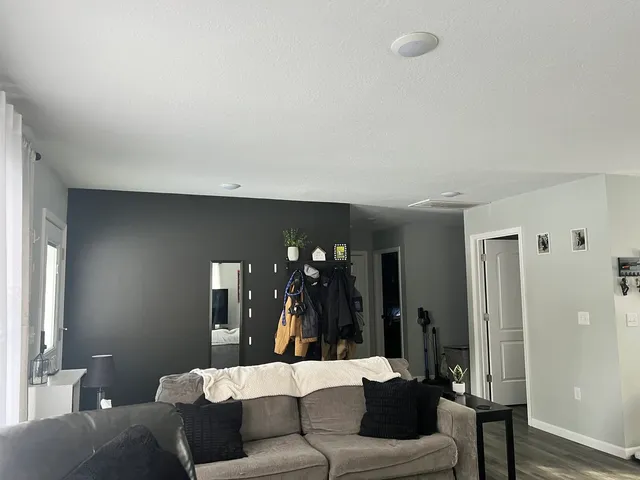 a living room with furniture and a table