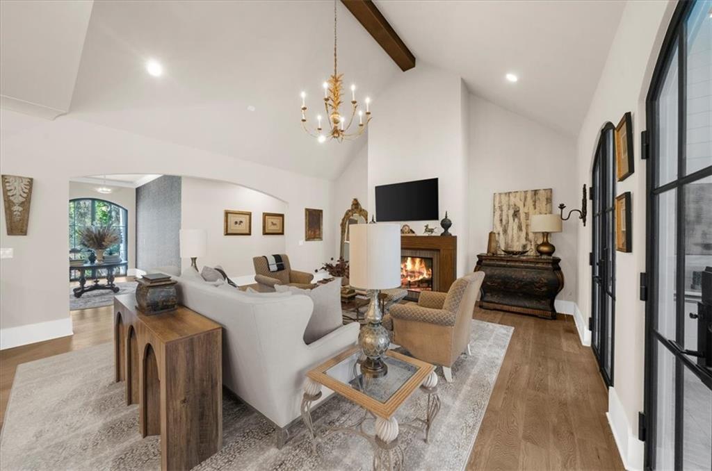 9773 Hightower Road Roswell, GA 30075 - Photo 11 of 79 a living room with furniture a fireplace and a flat screen tv