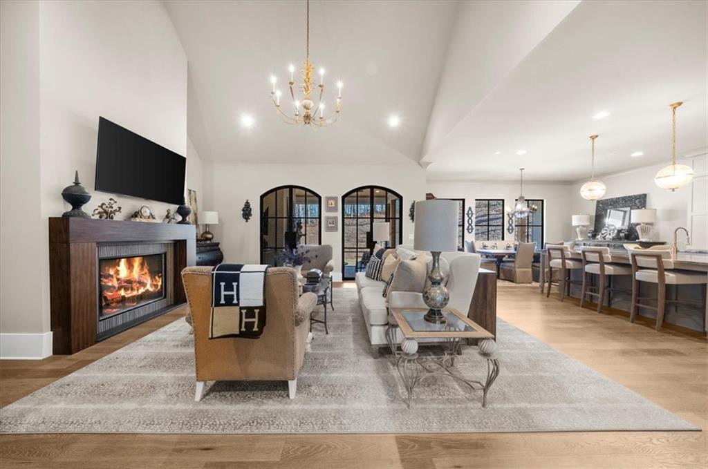 9773 Hightower Road Roswell, GA 30075 - Photo 16 of 79 a living room with fireplace furniture and a flat screen tv