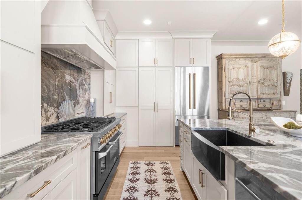 9773 Hightower Road Roswell, GA 30075 - Photo 22 of 79 a kitchen with stainless steel appliances a sink a stove and refrigerator