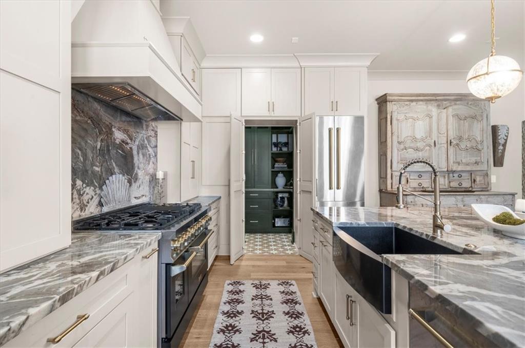 9773 Hightower Road Roswell, GA 30075 - Photo 25 of 79 a kitchen with stainless steel appliances a sink stove and cabinets