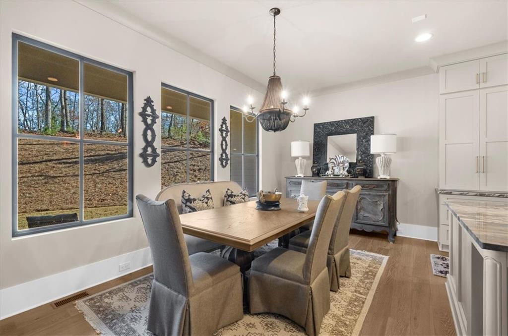 9773 Hightower Road Roswell, GA 30075 - Photo 29 of 79 a view of a dining room with furniture window and outside view