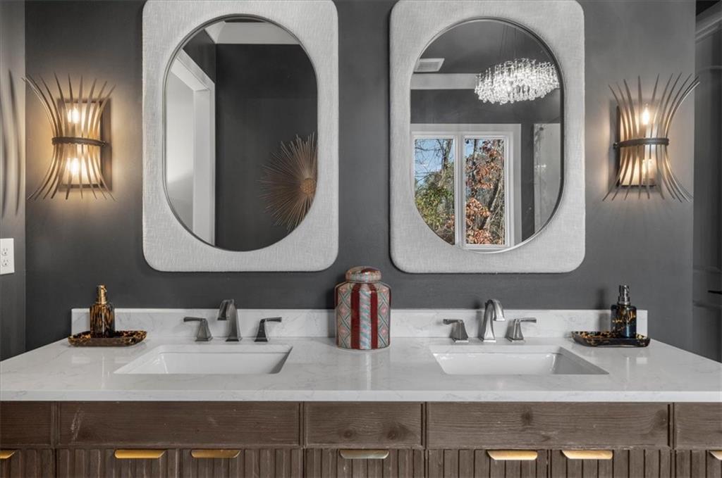 9773 Hightower Road Roswell, GA 30075 - Photo 37 of 79 a bathroom with double vanity sinks and a mirror