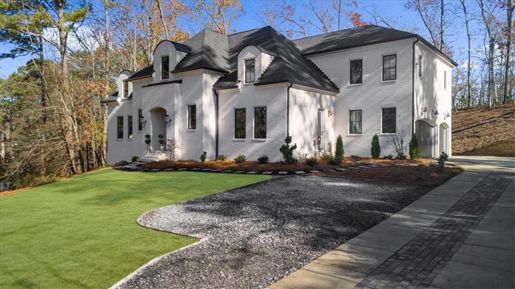 9773 Hightower Road Roswell, GA 30075 - Photo 4 of 79 a front view of house with yard