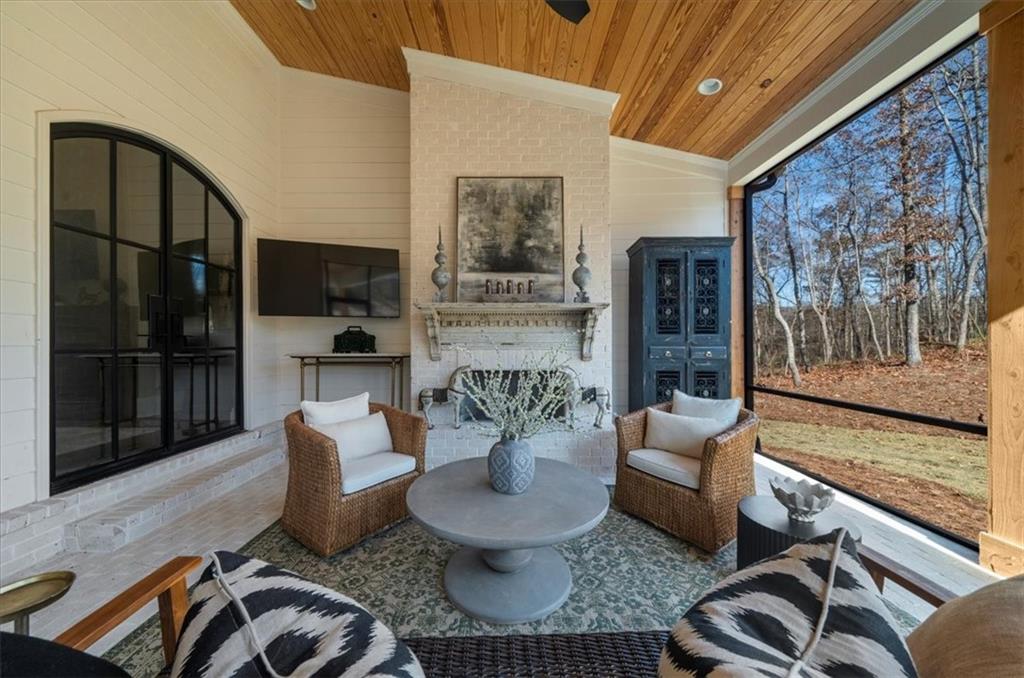 9773 Hightower Road Roswell, GA 30075 - Photo 44 of 79 a living room with furniture and a floor to ceiling window