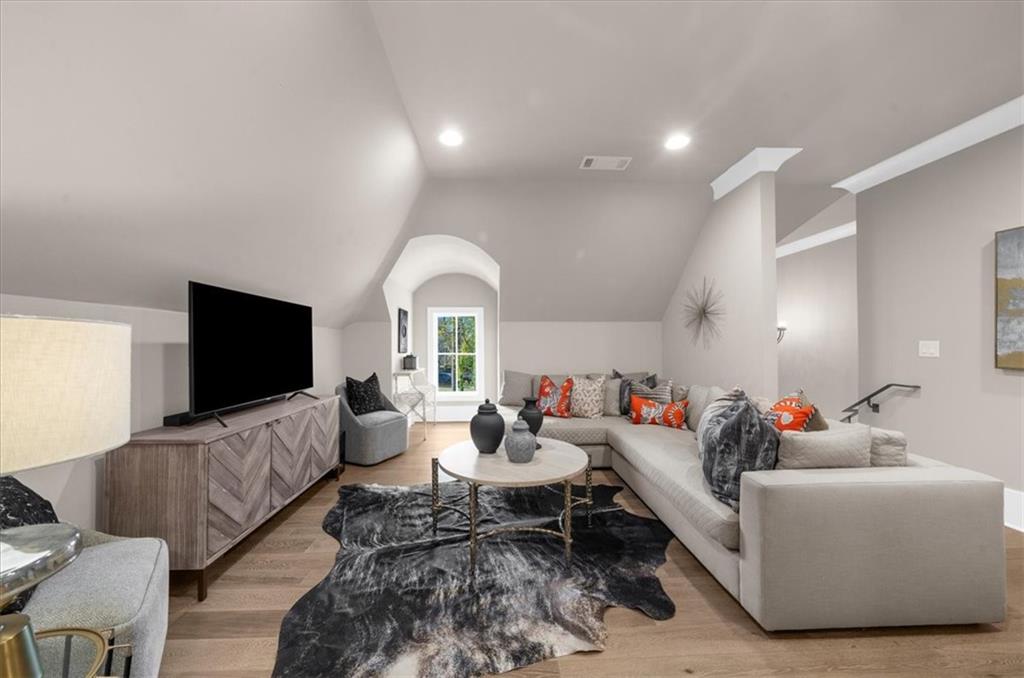 9773 Hightower Road Roswell, GA 30075 - Photo 48 of 79 a living room with furniture and a flat screen tv