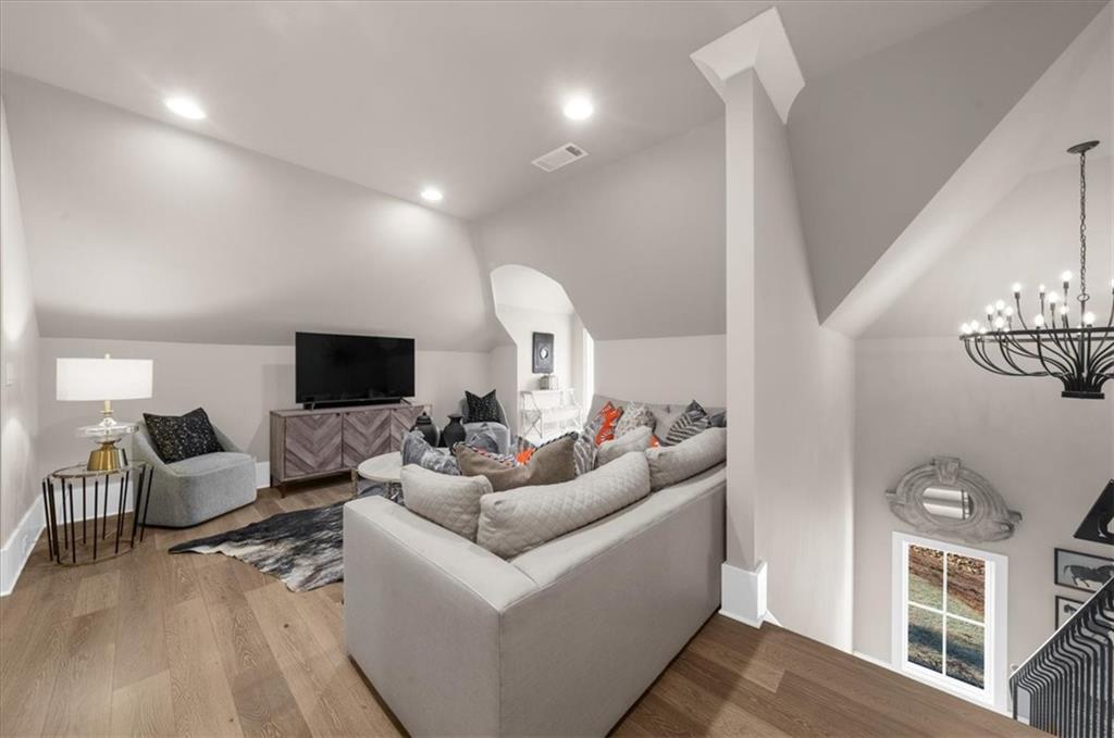 9773 Hightower Road Roswell, GA 30075 - Photo 49 of 79 a living room with furniture and a flat screen tv