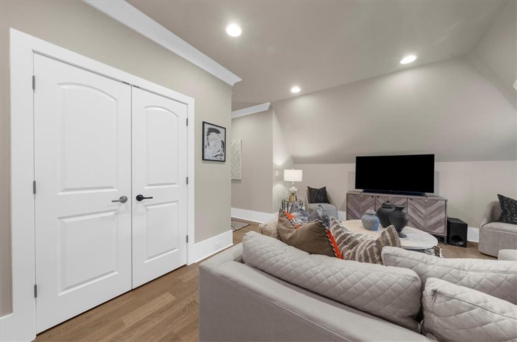 9773 Hightower Road Roswell, GA 30075 - Photo 50 of 79 a living room with furniture and a flat screen tv