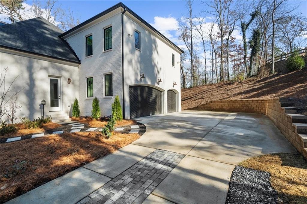 9773 Hightower Road Roswell, GA 30075 - Photo 5 of 79 a view of a house with snow on the road