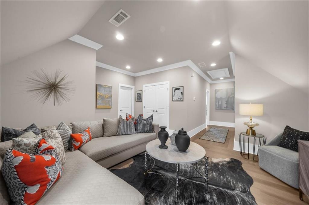 9773 Hightower Road Roswell, GA 30075 - Photo 51 of 79 a living room with furniture and a wooden floor