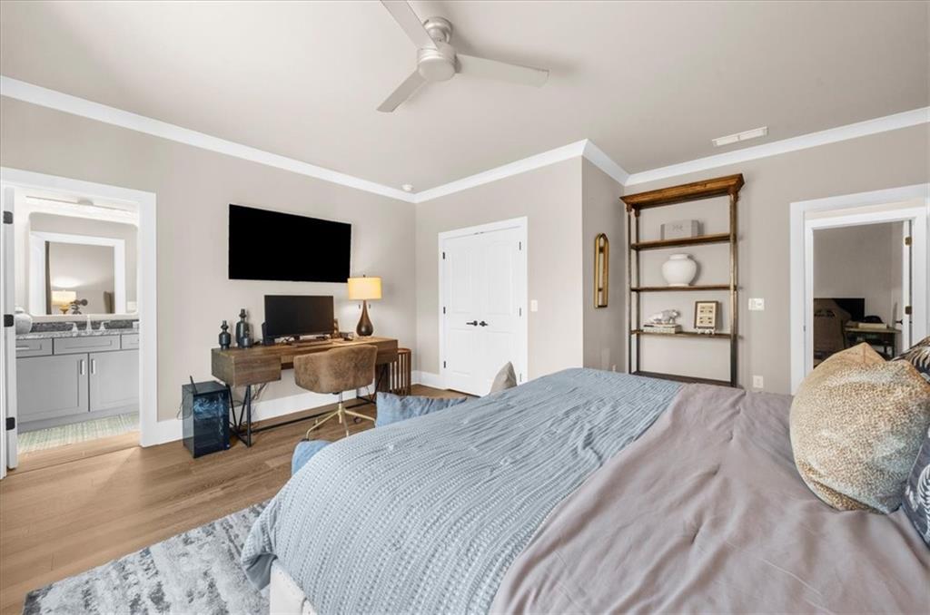 9773 Hightower Road Roswell, GA 30075 - Photo 58 of 79 a bedroom with a bed and a flat screen tv