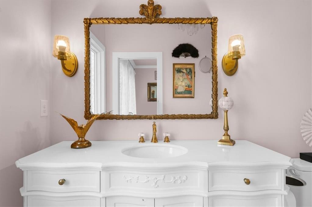 9773 Hightower Road Roswell, GA 30075 - Photo 62 of 79 a bathroom with a sink and a mirror