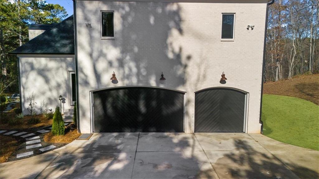 9773 Hightower Road Roswell, GA 30075 - Photo 66 of 79 a front view of a house with a yard