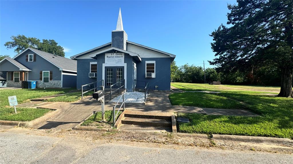 0 East Nelson Street Denison, TX 75021 - Photo 19 of 28 a front view of a house with a yard