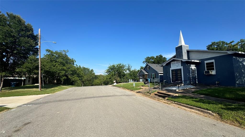 0 East Nelson Street Denison, TX 75021 - Photo 20 of 28 a backyard of a house with yard table and chairs