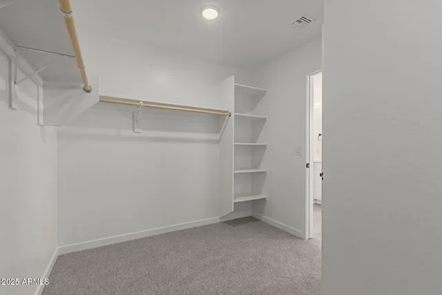 a view of an empty walk in closet