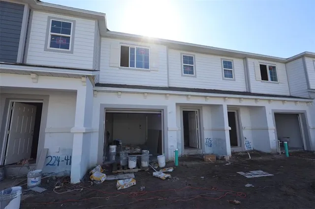 a front view of a house with table and chairs