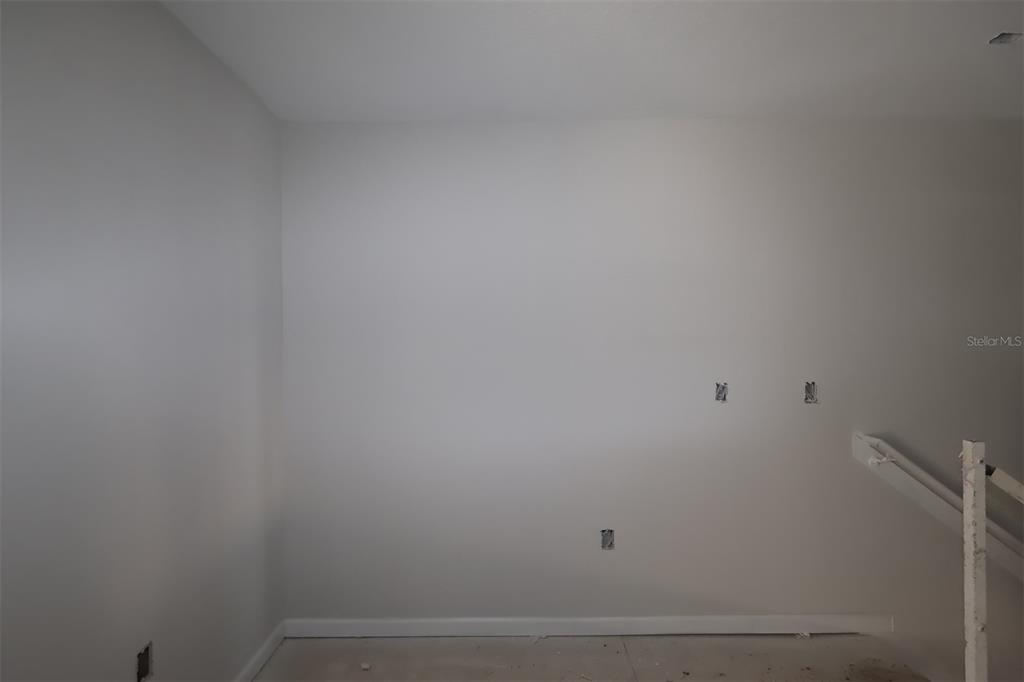 4108 Campsite Loop Orlando, FL 32824 - Photo 3 of 12 a view of small space with empty racks