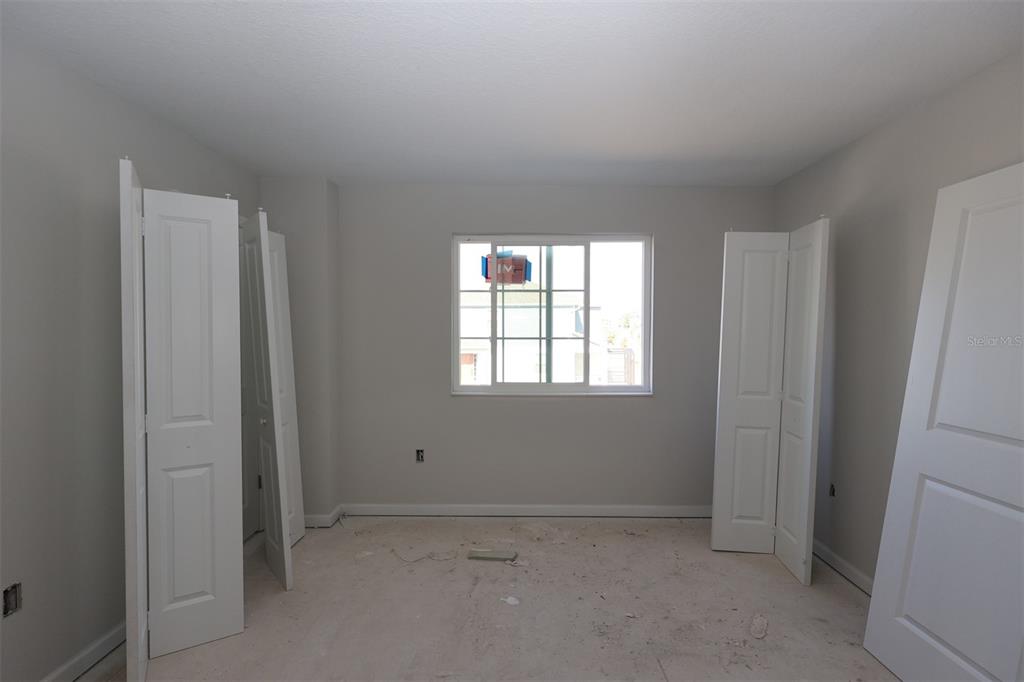 4108 Campsite Loop Orlando, FL 32824 - Photo 5 of 12 an empty room with windows