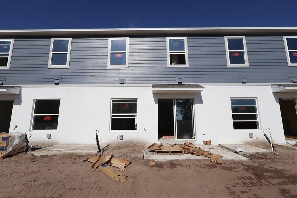 4108 Campsite Loop Orlando, FL 32824 - Photo 8 of 12 a backyard of a house with seating space