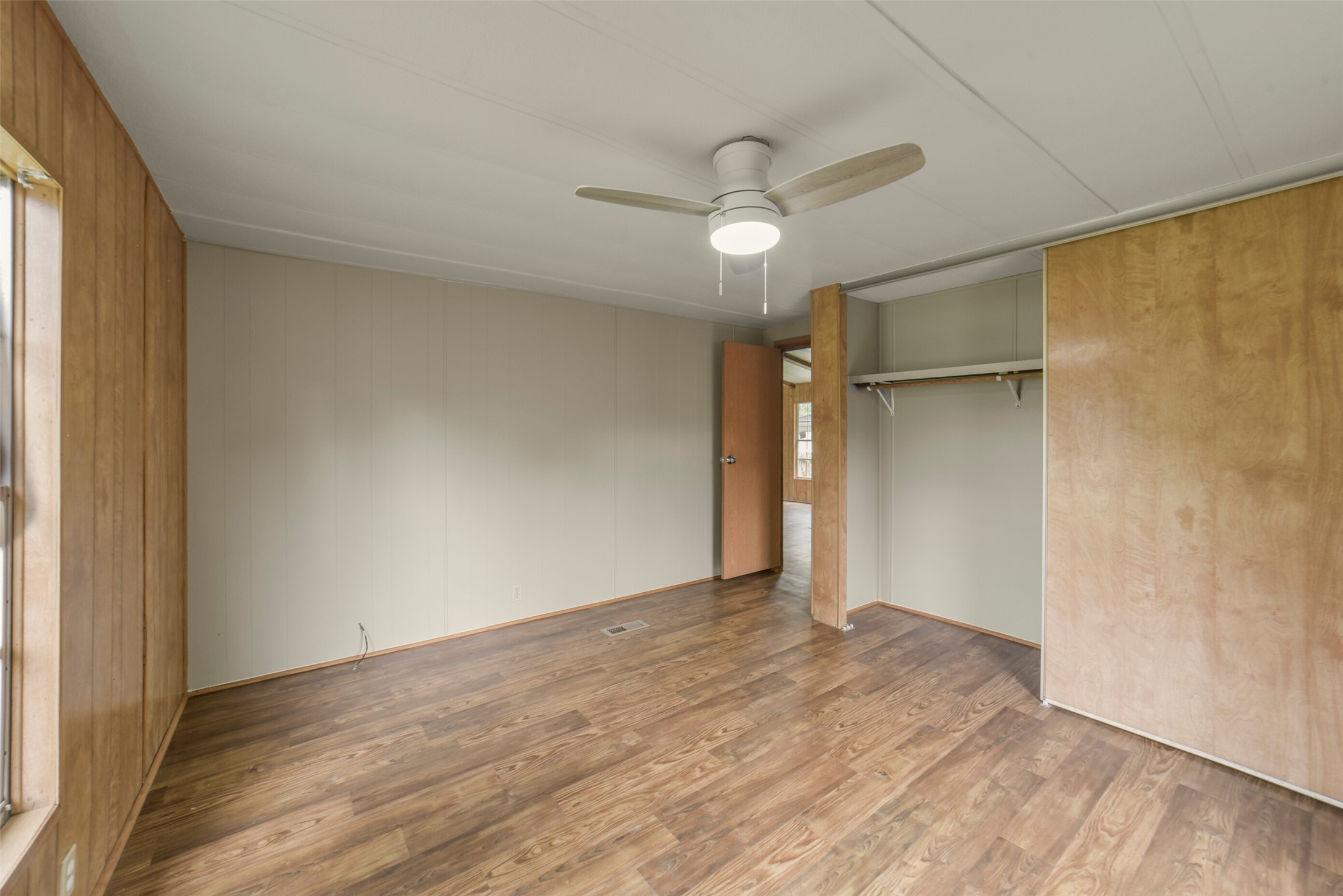 11023 Forrest Valley Drive Houston, TX 77065 - Photo 31 of 47 an empty room with wooden floor closet and windows