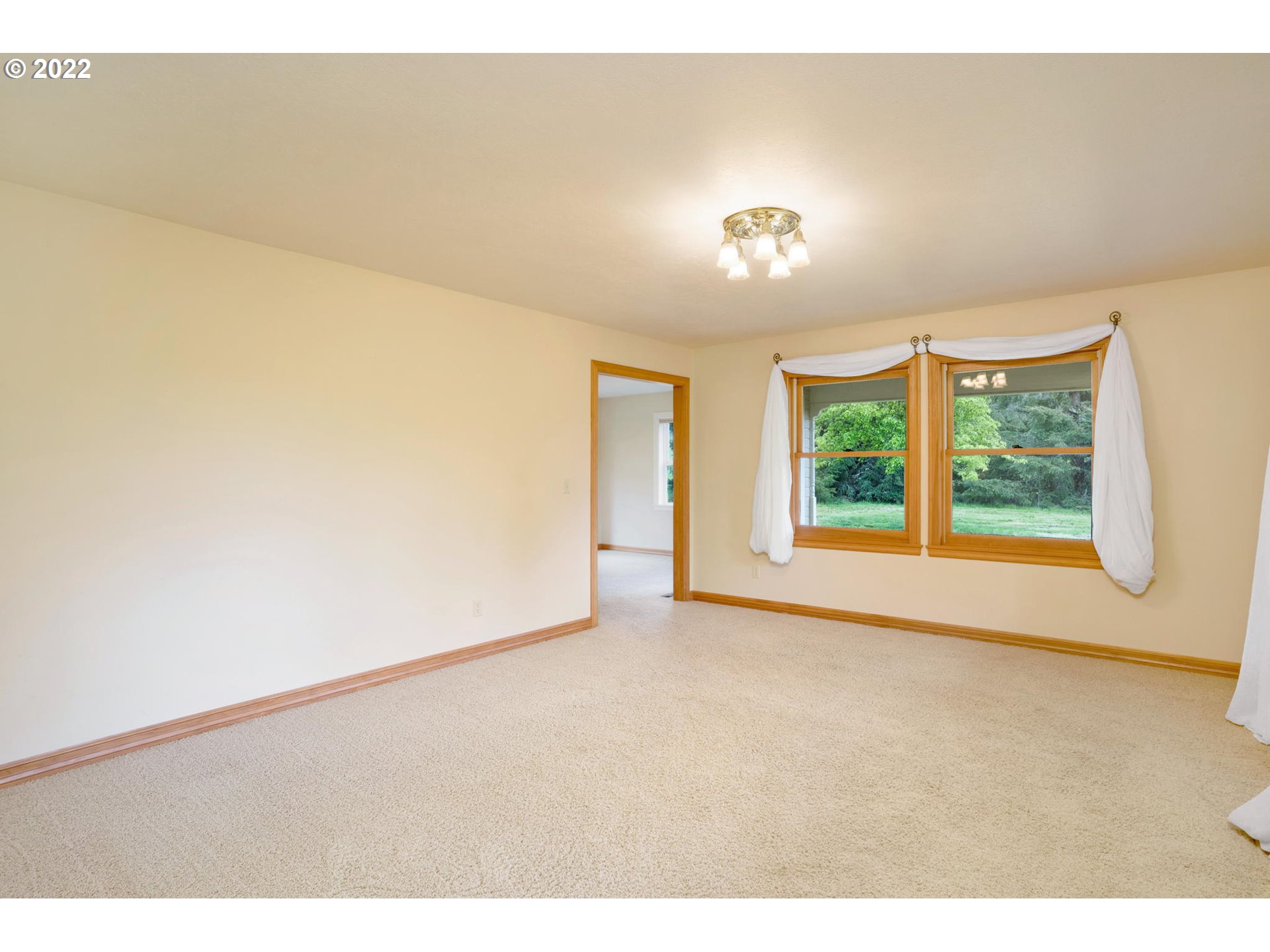 16410 Southeast Royer Road Damascus, OR 97089 - Photo 12 of 32 a view of an empty room with a window