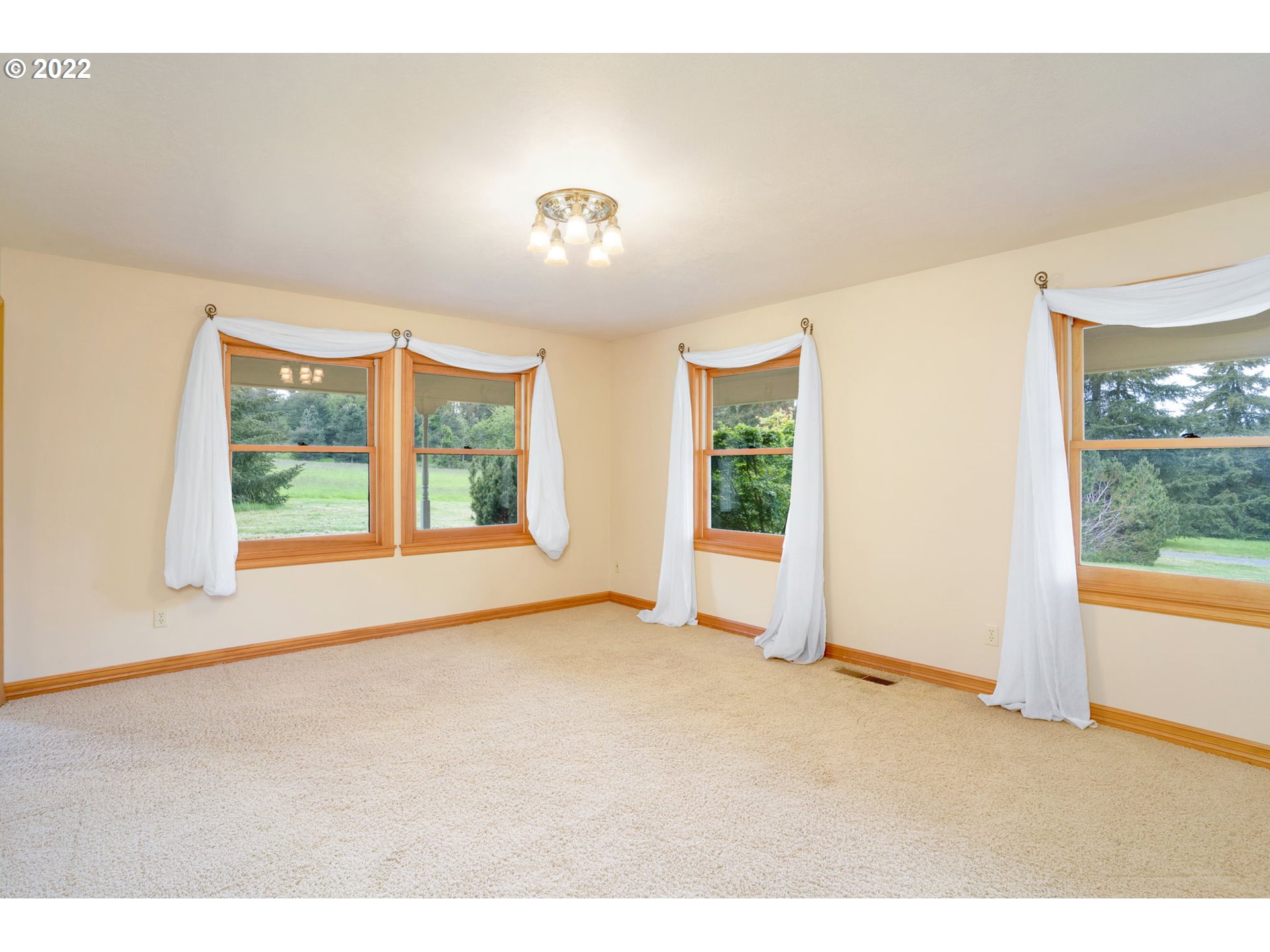 16410 Southeast Royer Road Damascus, OR 97089 - Photo 13 of 32 a view of an empty room with a window