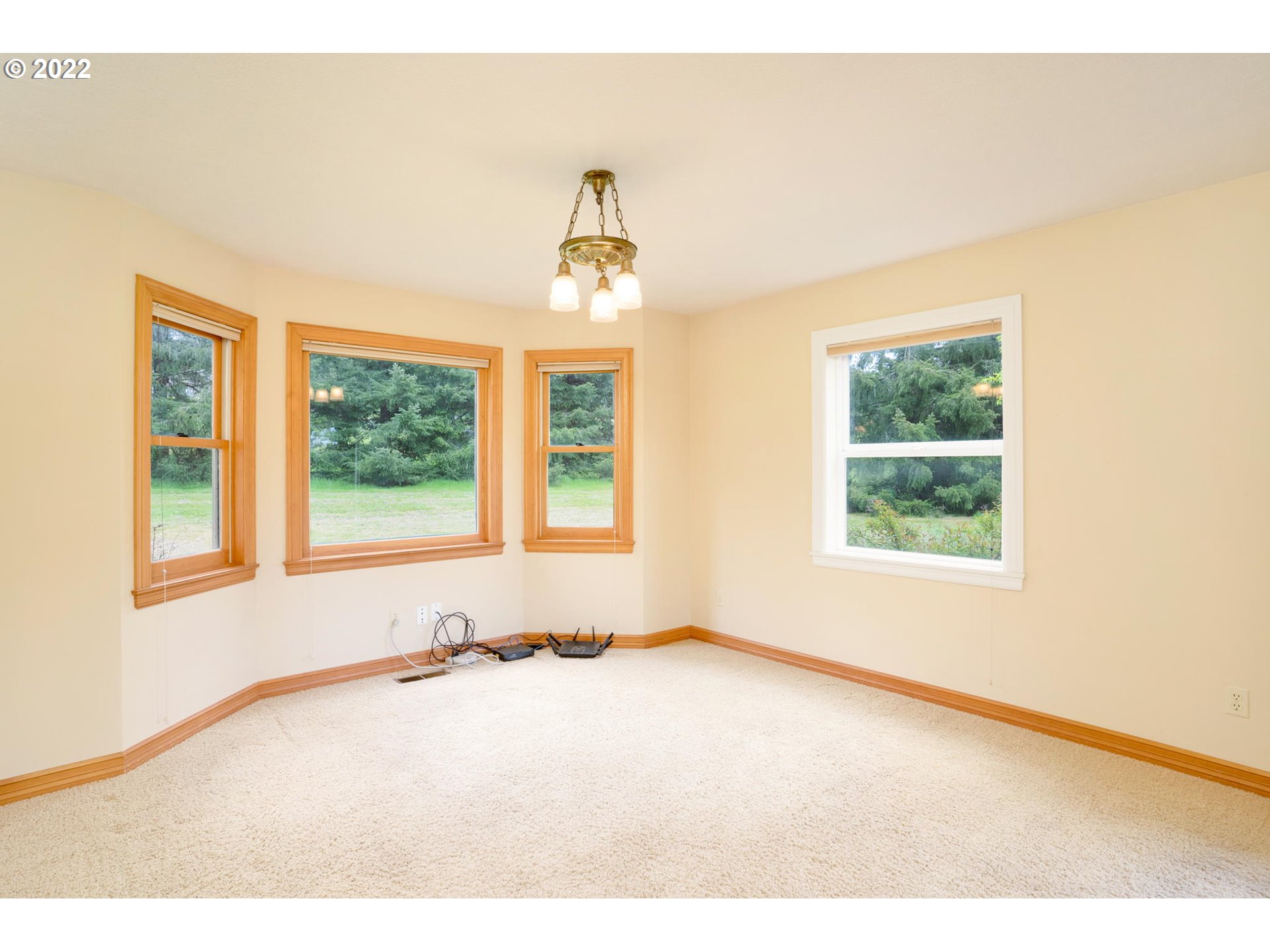 16410 Southeast Royer Road Damascus, OR 97089 - Photo 14 of 32 a big room with windows and chandelier fan
