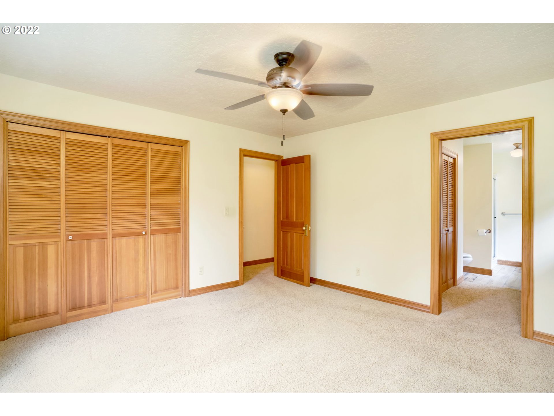 16410 Southeast Royer Road Damascus, OR 97089 - Photo 16 of 32 a view of a livingroom with a chandelier fan and windows
