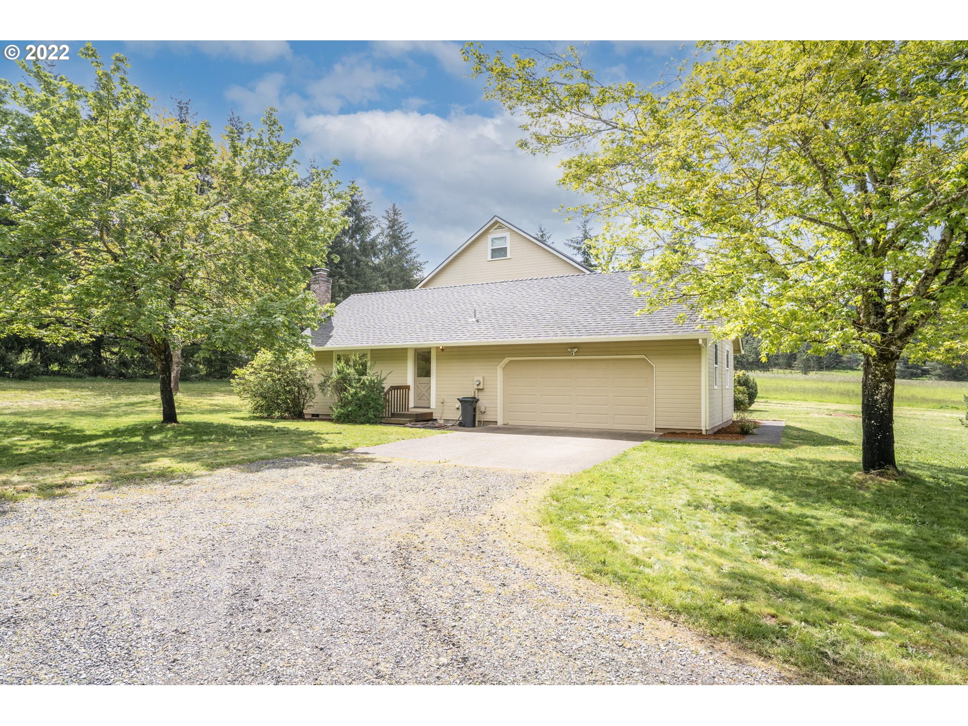 16410 Southeast Royer Road Damascus, OR 97089 - Photo 24 of 32 a front view of a house with a yard and garage