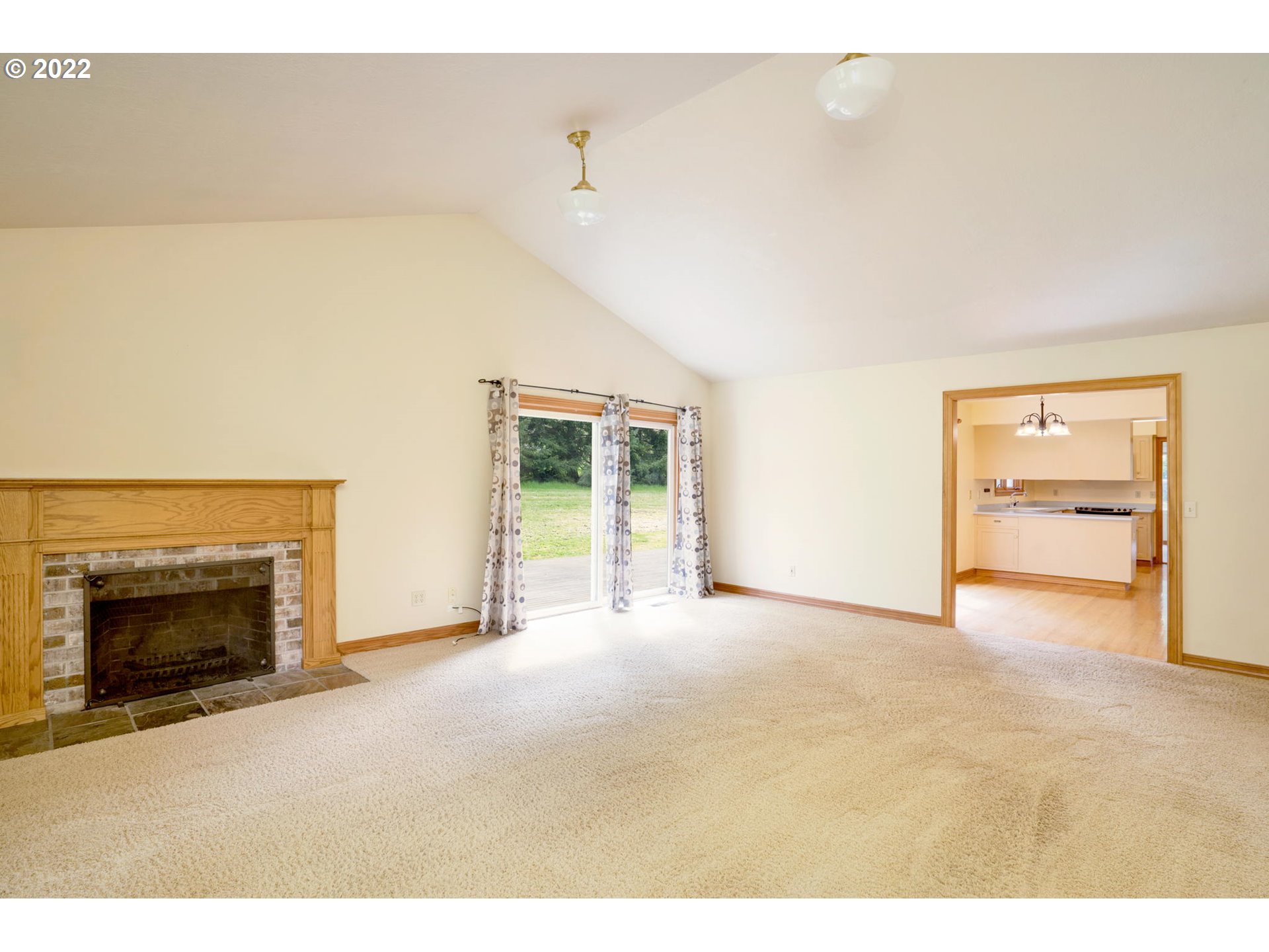 16410 Southeast Royer Road Damascus, OR 97089 - Photo 8 of 32 a view of empty room with a fireplace