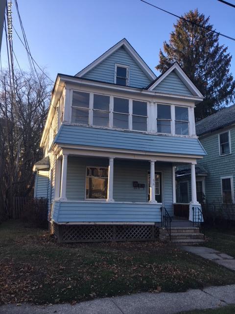a view of front door and deck of the house