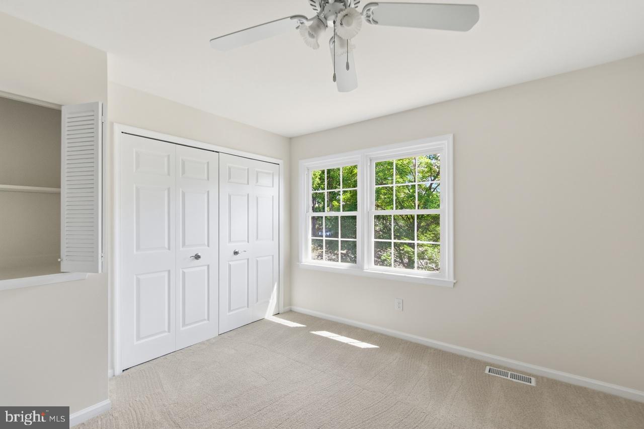 7100 Counter Place Burke, VA 22015 - Photo 34 of 54 Bedroom 2 double closets, fan and TV niche