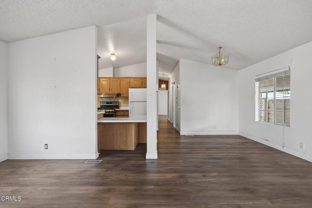 2177 Robin Avenue, Unit 2177A Oxnard, CA 93033 - Photo 11 of 29 a view of kitchen with wooden floor and electronic appliances