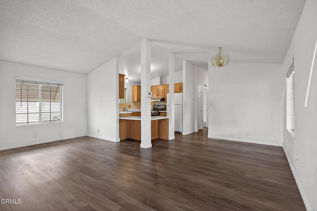 2177 Robin Avenue, Unit 2177A Oxnard, CA 93033 - Photo 10 of 29 an empty room with wooden floor closet and windows
