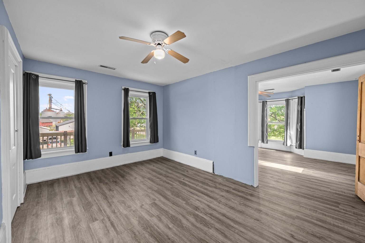 200 West Locust Street Cambridge, IL 61238 - Photo 29 of 32 a view of an empty room with wooden floor and a window
