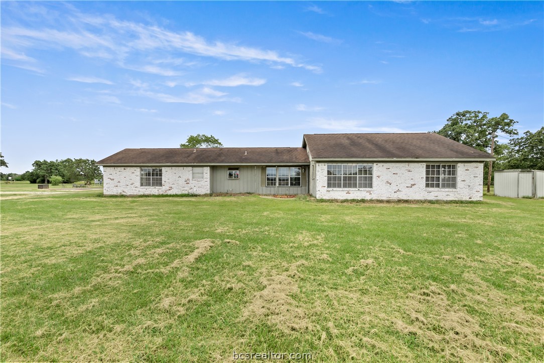 8166 Riley Road Bryan, TX 77808 - Photo 4 of 46 a front view of a house with a garden