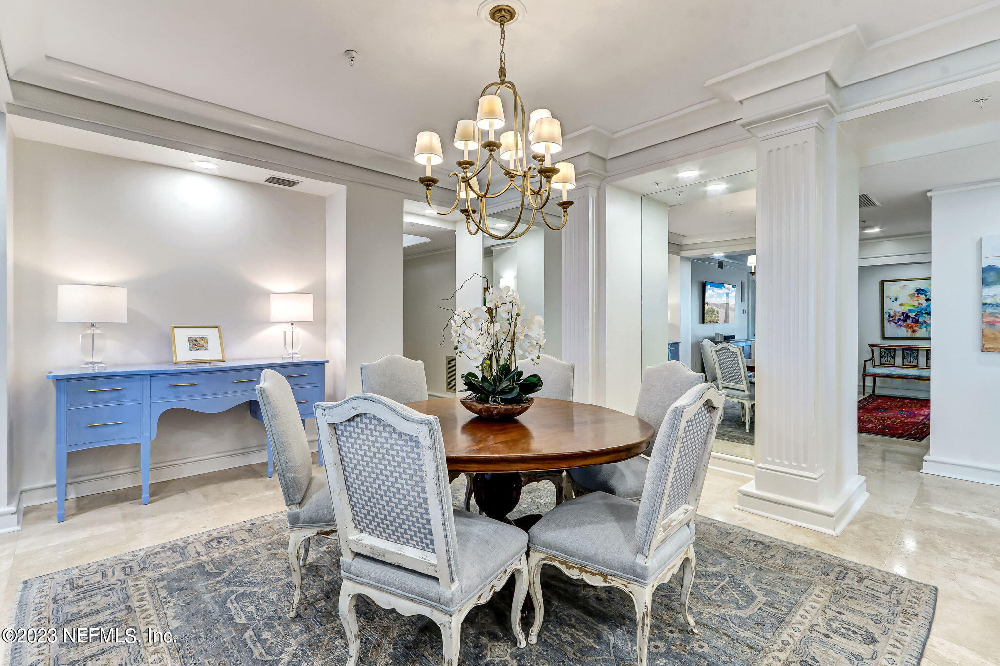 2358 Riverside Avenue, Unit 401 Jacksonville, FL 32204 - Photo 12 of 92 a dining room with furniture a chandelier and wooden floor