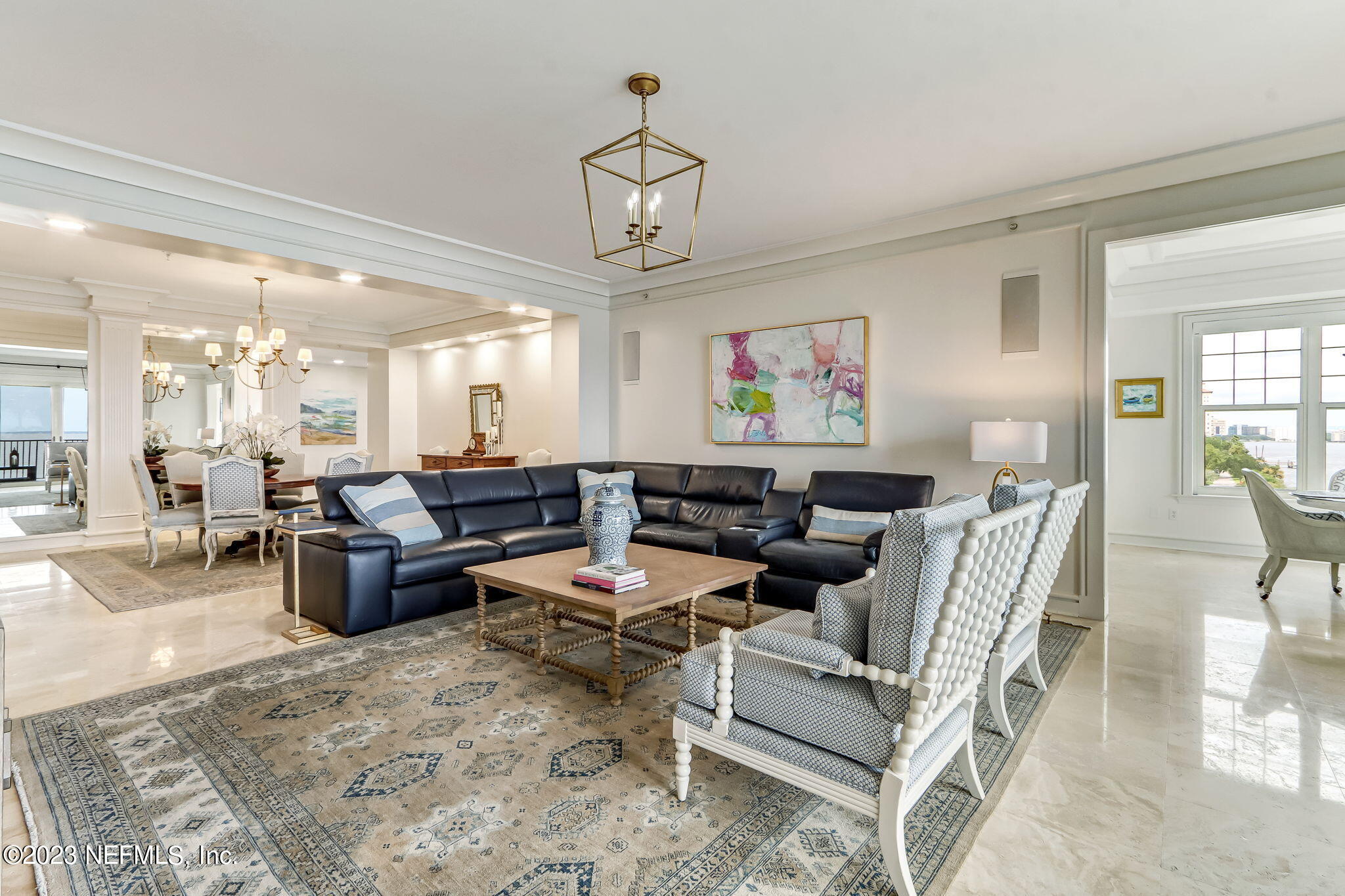 2358 Riverside Avenue, Unit 401 Jacksonville, FL 32204 - Photo 15 of 92 a living room with furniture kitchen view and a chandelier