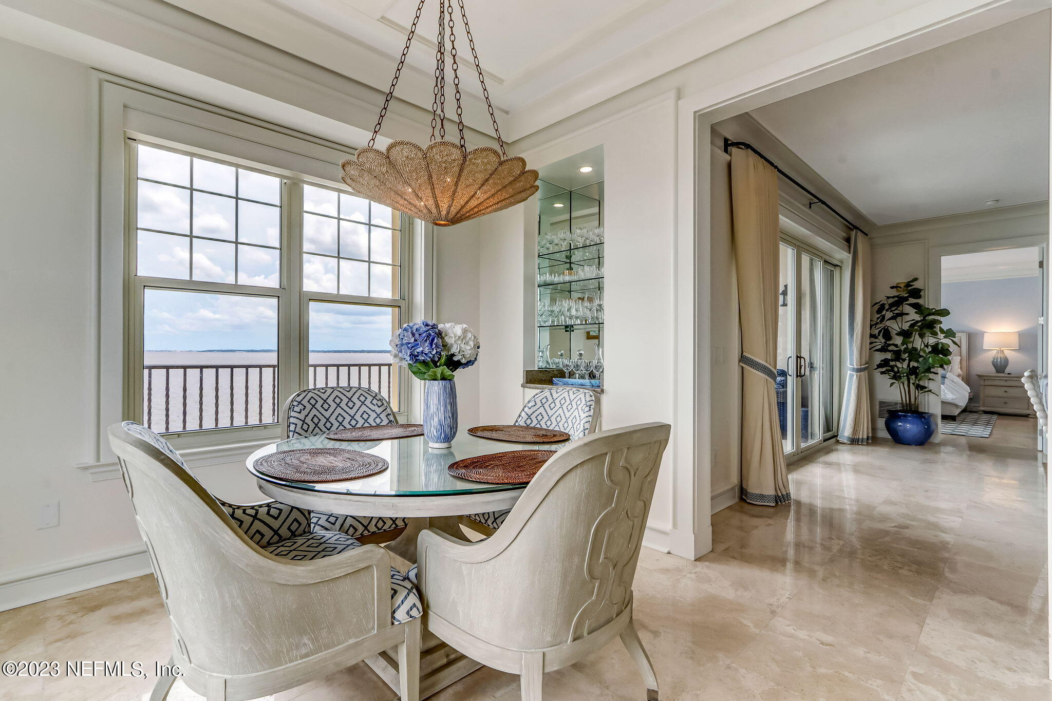 2358 Riverside Avenue, Unit 401 Jacksonville, FL 32204 - Photo 18 of 92 a view of a dining room with furniture wooden floor and chandelier