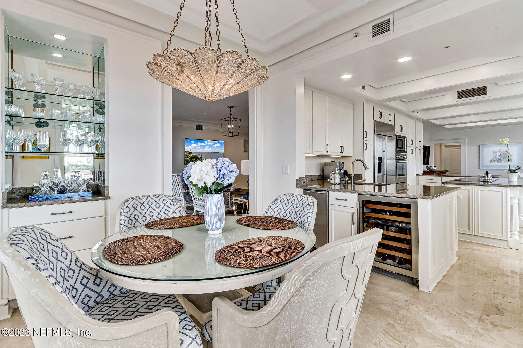 2358 Riverside Avenue, Unit 401 Jacksonville, FL 32204 - Photo 19 of 92 a kitchen with dining table and chairs