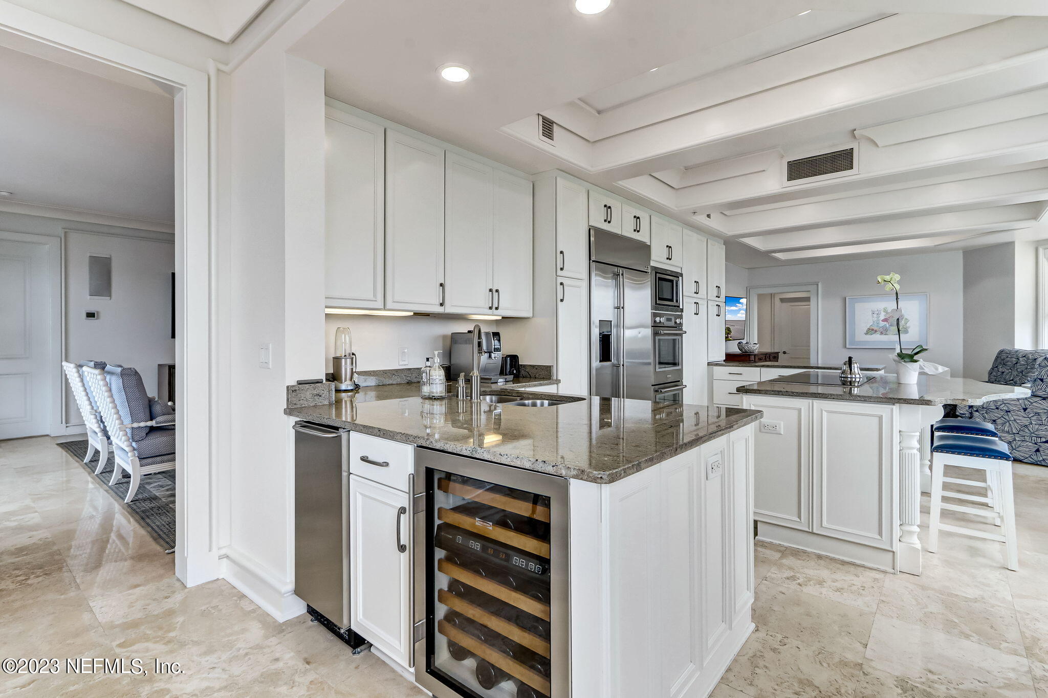 2358 Riverside Avenue, Unit 401 Jacksonville, FL 32204 - Photo 24 of 92 a kitchen with kitchen island granite countertop a sink appliances cabinets and furniture