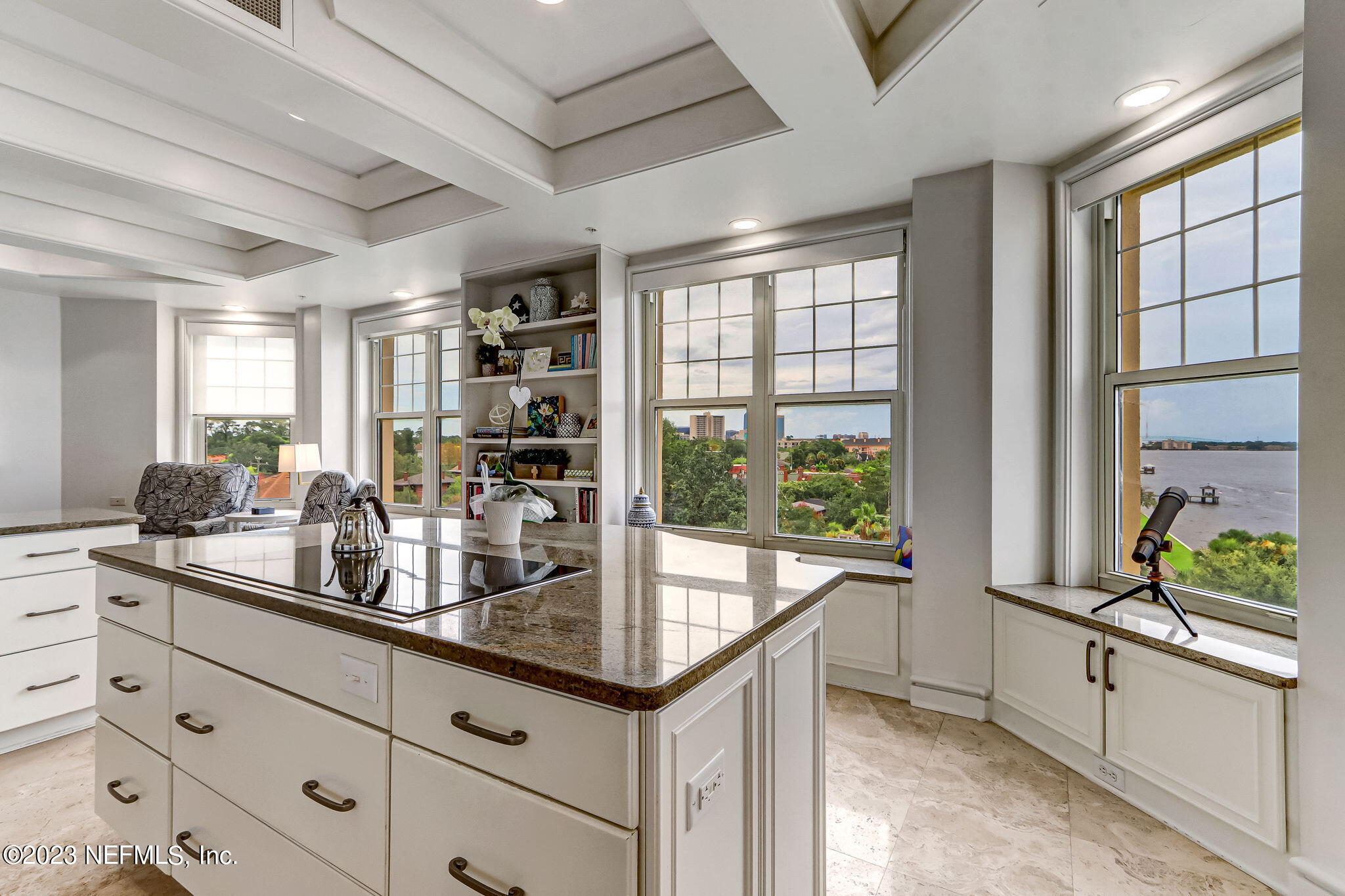 2358 Riverside Avenue, Unit 401 Jacksonville, FL 32204 - Photo 27 of 92 a kitchen with granite countertop a sink and a large window