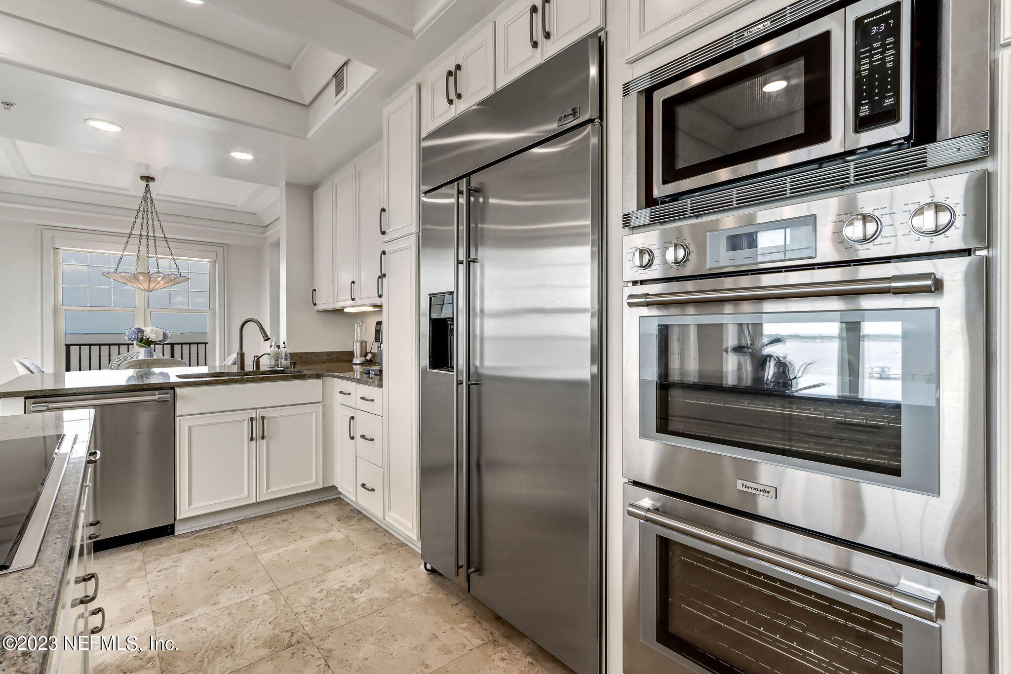 2358 Riverside Avenue, Unit 401 Jacksonville, FL 32204 - Photo 28 of 92 a kitchen with stainless steel appliances and cabinets