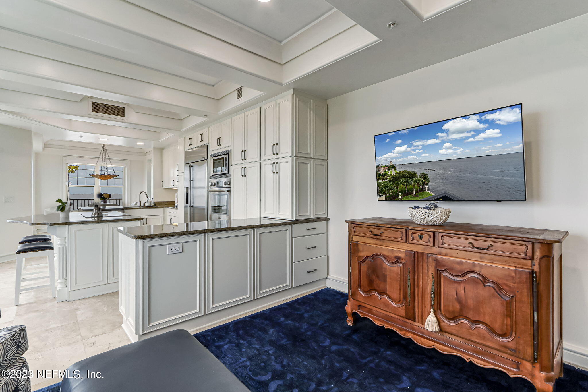 2358 Riverside Avenue, Unit 401 Jacksonville, FL 32204 - Photo 32 of 92 a kitchen with stainless steel appliances granite countertop a stove and white cabinets
