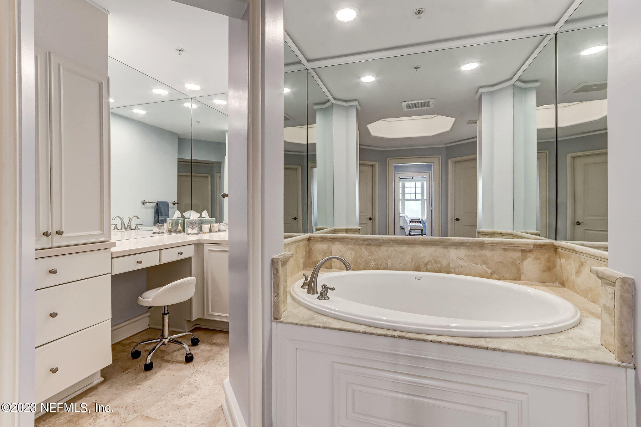 2358 Riverside Avenue, Unit 401 Jacksonville, FL 32204 - Photo 47 of 92 a bathroom with a tub a sink shower and a mirror